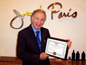 Joseph Paris with the U.S. Patent for the MHP Hair System